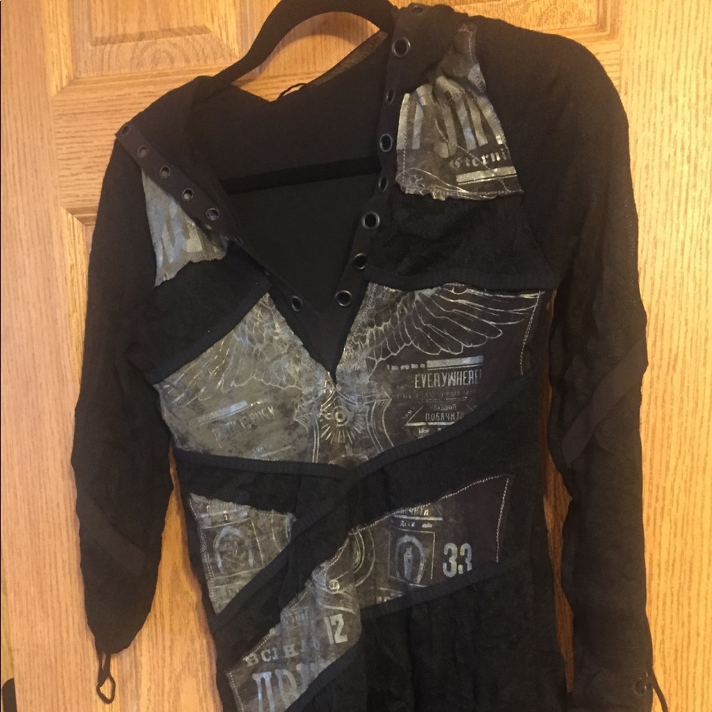 Salvage long sleeve top with lace up sleeves.